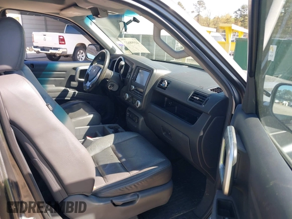 2007 Honda Ridgeline RTL z VIN 2HJYK16557H531198, wystawiony jako IAAI lot #41998612 z przebiegiem 194 975 mil mil oraz . Historia ofert i sprzedaży dostępna na DreamBid. Obrazek 5.