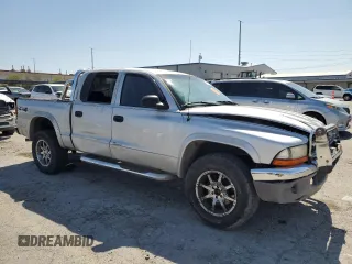 2004 Dodge Dakota SLT with VIN 1D7HG48N74S509797, listed as a Copart auction lot 57797055 with 214,275 mi miles and Salvage title. Bid and sale history available at DreamBid. Image 4.