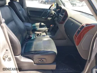 2003 Mitsubishi Montero LTD with VIN JA4NW51S53J030850, listed as a IAAI auction lot 42063733 with 210,810 mi miles. Bid and sale history available at carsss.com. Image 5.