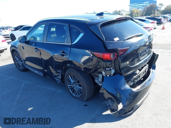 2021 Mazda CX-5 Touring with VIN JM3KFACM2M0339349, listed as a IAAI auction lot 41651005 with 53,792 mi miles. Bid and sale history available at carsss.com. Image 3.
