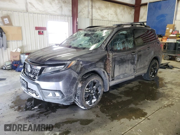 2021 Honda Passport Elite z VIN 5FNYF8H05MB021597, wystawiony jako Copart lot #44463515 z przebiegiem Nie podano mil oraz Szkoda całkowita • Salvage title. Historia ofert i sprzedaży dostępna na DreamBid. Obrazek 1.