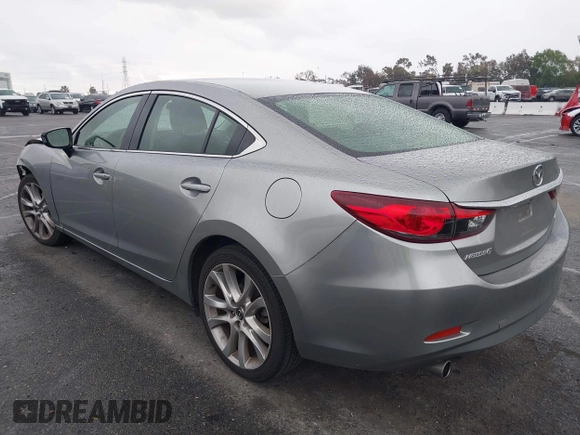 2014 Mazda 6 i Touring with VIN JM1GJ1V60E1141831, listed as a IAAI auction lot 42131200 with 86,597 mi miles and . Bid and sale history available at DreamBid. Image 3.