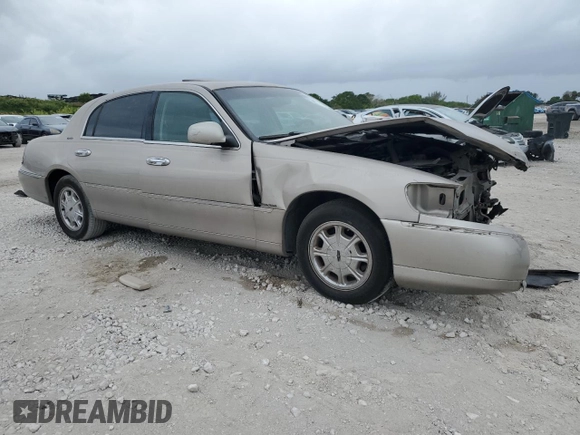 2000 Lincoln Town Car Signature с VIN 1LNHM82W1YY903645, выставлен на аукционе Copart как лот 55663175 с пробегом Не указан миль и Списание • Salvage title. История ставок и продаж доступна на DreamBid. Изображение 4.