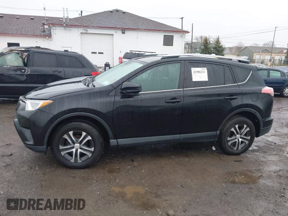2018 Toyota RAV4 LE with VIN 2T3BFREV2JW788700, listed as a IAAI auction lot 41986212 with 87,704 mi miles. Bid and sale history available at carsss.com. Image 13.