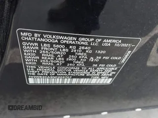 2022 Volkswagen Atlas SE z VIN 1V2WE2CA3NC203707, wystawiony jako IAAI lot #41720912 z przebiegiem 50 572 mil mil oraz . Historia ofert i sprzedaży dostępna na DreamBid. Obrazek 9.