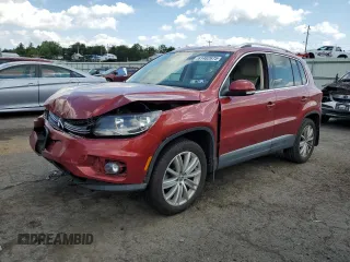 2014 Volkswagen Tiguan S with VIN WVGBV3AX8EW109071, listed as a Copart auction lot 61482675 with 112,489 mi miles and Salvage title. Bid and sale history available at DreamBid. Image 1.