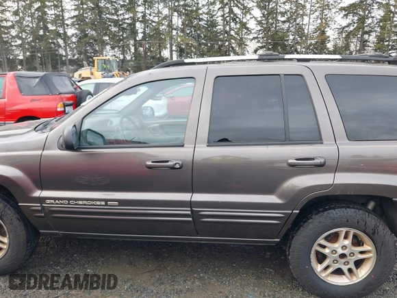 1999 Jeep Grand Cherokee Limited with VIN 1J4GW68N7XC739479, listed as a IAAI auction lot 41448323 with 129,840 mi miles. Bid and sale history available at carsss.com. Image 14.