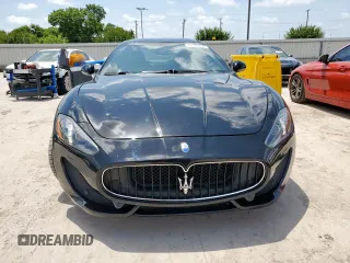 2014 Maserati GranTurismo Sport z VIN ZAM45VLAXE0083282, wystawiony jako Copart lot #61799155 z przebiegiem 71 517 mil mil oraz Szkoda całkowita • Salvage title. Historia ofert i sprzedaży dostępna na DreamBid. Obrazek 5.