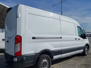 2023 Ford Transit Cargo with VIN 1FTBR1C85PKC08945, listed as a IAAI auction lot 41385685 with 5,577 mi miles and . Bid and sale history available at DreamBid. Image 4.