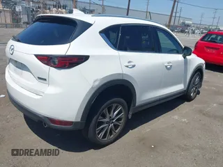 2020 Mazda CX-5 Grand Touring with VIN JM3KFADM9L0821930, listed as a IAAI auction lot 42549986 with 29,929 mi miles and . Bid and sale history available at DreamBid. Image 4.