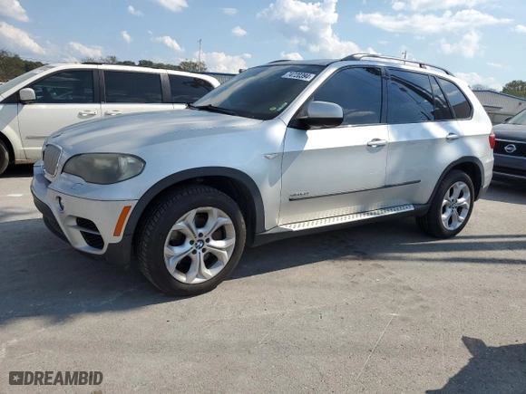 2011 BMW X5 50i with VIN 5UXZV8C54BL420357, listed as a Copart auction lot 74720394 with 165,462 mi miles and Clean Title. Bid and sale history available at carsss.com. Image 1.