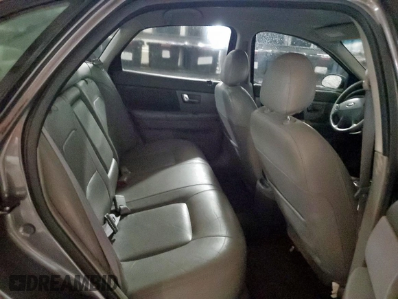 2002 Ford Taurus SES Standard z VIN 1FAFP55U72A161401, wystawiony jako Copart lot #55893125 z przebiegiem 128 258 mil mil oraz Czysty tytuł • Clean title. Historia ofert i sprzedaży dostępna na DreamBid. Obrazek 10.