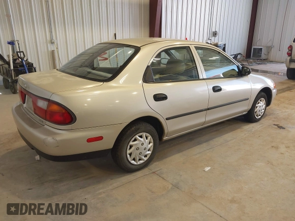 1997 Mazda Protege DX z VIN JM1BC1415V0133823, wystawiony jako IAAI lot #42091960 z przebiegiem 149 959 mil mil oraz . Historia ofert i sprzedaży dostępna na DreamBid. Obrazek 4.