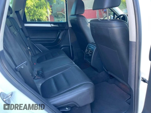 2014 Volkswagen Touareg Sport with VIN WVGEF9BP7ED003332, listed as a Copart auction lot 63043535 with 179,727 mi miles and Salvage title. Bid and sale history available at DreamBid. Image 6.
