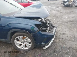 2022 Volkswagen Atlas SE z VIN 1V2HR2CA0NC561411, wystawiony jako IAAI lot #41941719 z przebiegiem Nie podano mil oraz . Historia ofert i sprzedaży dostępna na DreamBid. Obrazek 18.