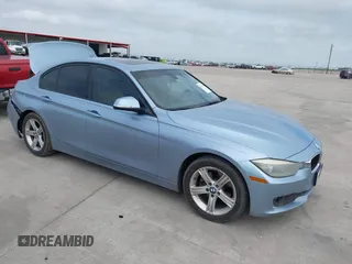 2013 BMW 3 Series 320i with VIN WBA3B1C54DK128284, listed as a IAAI auction lot 40315808 with 136,104 mi miles. Bid and sale history available at carsss.com. Image 1.