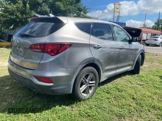 2017 Hyundai Santa Fe 2.4L with VIN 5NMZTDLB8HH029955, listed as a IAAI auction lot 42612654 with 153,050 mi miles and . Bid and sale history available at DreamBid. Image 4.