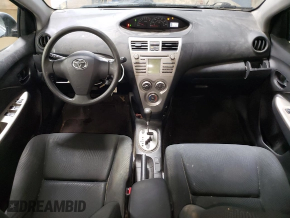 2010 Toyota Yaris with VIN JTDBT4K35A4064446, listed as a Copart auction lot 52099855 with 61,934 mi miles and Salvage Title. Bid and sale history available at carsss.com. Image 8.