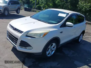 2013 Ford Escape SE with VIN 1FMCU0GX2DUB85361, listed as a IAAI auction lot 42552881 with 211,032 mi miles and . Bid and sale history available at DreamBid. Image 2.