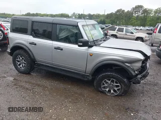 2021 Ford Bronco z VIN 1FMEE5DP7MLA78805, wystawiony jako IAAI lot #42363222 z przebiegiem 57 510 mil mil oraz . Historia ofert i sprzedaży dostępna na DreamBid. Obrazek 1.