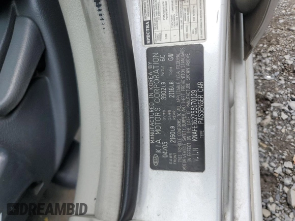 2005 Kia Spectra z VIN KNAFE162755170129, wystawiony jako Copart lot #60217065 z przebiegiem 94 458 mil mil oraz Szkoda całkowita • Salvage title. Historia ofert i sprzedaży dostępna na DreamBid. Obrazek 13.