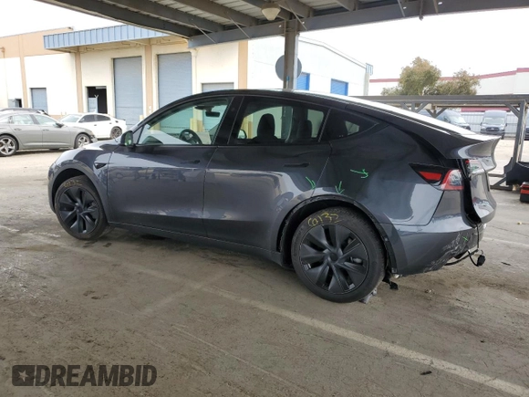 2025 Tesla Model Y Long Range with VIN 7SAYGDED2SF234388, listed as a Copart auction lot 47250965 with 3,702 mi miles and Salvage Title. Bid and sale history available at DreamBid. Image 2.