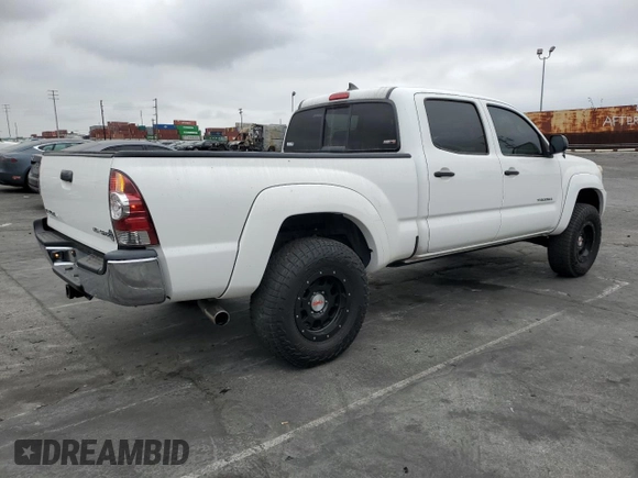 2014 Toyota Tacoma PreRunner with VIN 3TMKU4HN9EM040957, listed as a Copart auction lot 76579404 with 91,222 mi miles and Salvage title. Bid and sale history available at DreamBid. Image 3.