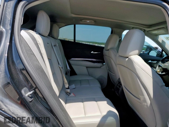 2023 Cadillac XT4 FWD Luxury z VIN 1GYAZAR42PF102696, wystawiony jako Copart lot #60524065 z przebiegiem 1 903 mil mil oraz Szkoda całkowita • Salvage title. Historia ofert i sprzedaży dostępna na DreamBid. Obrazek 11.