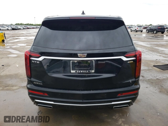2023 Cadillac XT6 FWD Premium Luxury z VIN 1GYKPCRS5PZ101867, wystawiony jako Copart lot #51773545 z przebiegiem 31 322 mil mil oraz Szkoda całkowita • Salvage title. Historia ofert i sprzedaży dostępna na DreamBid. Obrazek 6.