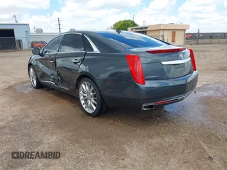2013 Cadillac XTS Platinum z VIN 2G61V5S32D9102537, wystawiony jako IAAI lot #42230895 z przebiegiem 120 810 mil mil oraz . Historia ofert i sprzedaży dostępna na DreamBid. Obrazek 3.