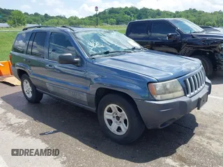 2004 Jeep Grand Cherokee Laredo with VIN 1J4GX48S44C205469, listed as a IAAI auction lot 42310571 with 154,929 mi miles and . Bid and sale history available at DreamBid. Image 1.