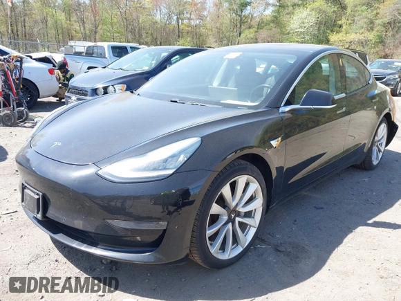 2018 Tesla Model 3 Long Range Battery z VIN 5YJ3E1EB6JF086612, wystawiony jako IAAI lot #42149440 z przebiegiem 101 170 mil mil oraz . Historia ofert i sprzedaży dostępna na DreamBid. Obrazek 2.