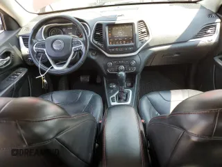 2015 Jeep Cherokee Trailhawk with VIN 1C4PJMBSXFW661218, listed as a Copart auction lot 61364895 with 139,200 mi miles and Salvage title. Bid and sale history available at DreamBid. Image 8.