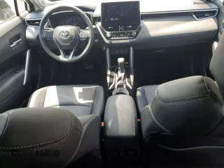 2023 Toyota Corolla Cross XLE with VIN 7MUDAABGXPV060797, listed as a Copart auction lot 62110665 with 18,293 mi miles and Salvage title. Bid and sale history available at DreamBid. Image 8.