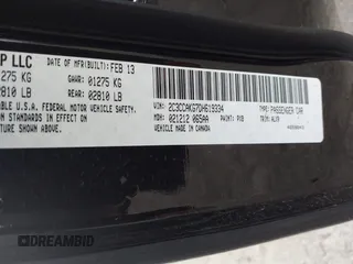 2013 Chrysler 300 with VIN 2C3CCAKG7DH619334, listed as a IAAI auction lot 41193765 with 162,662 mi miles. Bid and sale history available at carsss.com. Image 9.