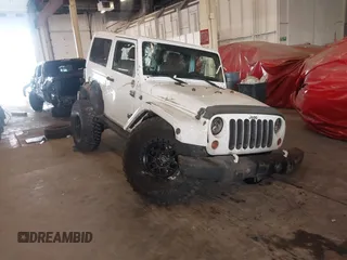 2012 Jeep Wrangler Arctic z VIN 1C4AJWBG9CL233232, wystawiony jako IAAI lot #42282805 z przebiegiem 109 927 mil mil oraz . Historia ofert i sprzedaży dostępna na DreamBid. Obrazek 1.