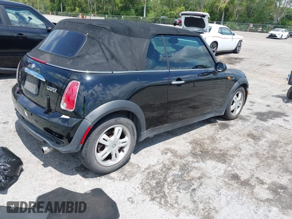 2006 MINI Convertible with VIN WMWRF33566TG15464, listed as a IAAI auction lot 42285777 with 144,430 mi miles and . Bid and sale history available at DreamBid. Image 4.