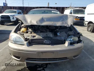2005 Ford Taurus SE z VIN 1FAFP53215A212736, wystawiony jako Copart lot #58439495 z przebiegiem Nie podano mil oraz Szkoda całkowita • Salvage title. Historia ofert i sprzedaży dostępna na DreamBid. Obrazek 5.