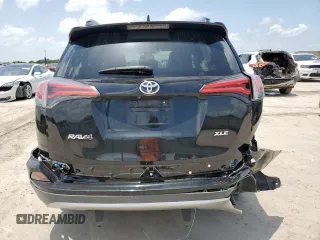 2018 Toyota RAV4 XLE with VIN 2T3WFREV2JW433186, listed as a Copart auction lot 61008705 with 57,310 mi miles and Salvage title. Bid and sale history available at DreamBid. Image 6.