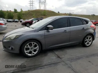 2014 Ford Focus Titanium with VIN 1FADP3N2XEL440389, listed as a Copart auction lot 65415355 with 119,728 mi miles and Clean title. Bid and sale history available at DreamBid. Image 1.