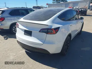 2021 Tesla Model Y Long Range with VIN 5YJYGDEE8MF125104, listed as a IAAI auction lot 41698065 with 25,177 mi miles and . Bid and sale history available at DreamBid. Image 4.