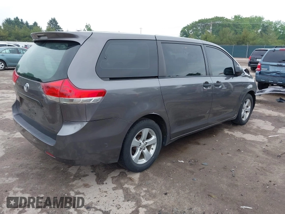 2014 Toyota Sienna L with VIN 5TDZK3DC5ES439593, listed as a IAAI auction lot 42420219 with 136,544 mi miles and . Bid and sale history available at DreamBid. Image 4.