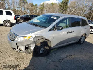 2012 Honda Odyssey LX with VIN 5FNRL5H26CB019627, listed as a Copart auction lot 87094684 with 214,563 mi miles and Salvage Title. Bid and sale history available at carsss.com. Image 1.