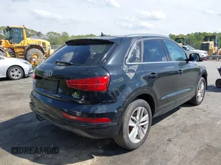 2017 Audi Q3 Premium Plus z VIN WA1JCCFS5HR001068, wystawiony jako IAAI lot #42038452 z przebiegiem 136 661 mil mil oraz . Historia ofert i sprzedaży dostępna na DreamBid. Obrazek 4.