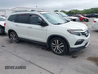 2016 Honda Pilot Elite with VIN 5FNYF6H00GB104329, listed as a IAAI auction lot 41905390 with 125,501 mi miles. Bid and sale history available at carsss.com. Image 1.
