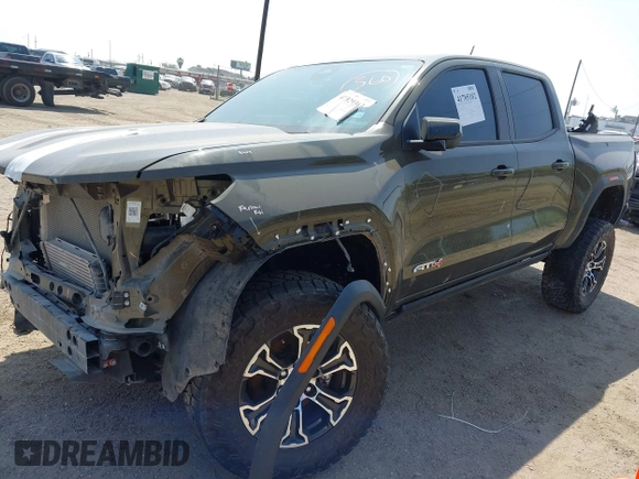 2023 GMC Canyon 4WD AT4 with VIN 1GTP6DEK5P1231432, listed as a IAAI auction lot 41785102 with 33,154 mi miles and . Bid and sale history available at carsss.com. Image 2.