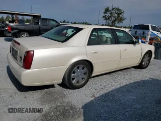 2003 Cadillac DeVille DTS z VIN 1G6KF57933U147843, wystawiony jako Copart lot #55875195 z przebiegiem 160 814 mil mil oraz Szkody całkowita. Historia ofert i sprzedaży dostępna na DreamBid. Obrazek 3.