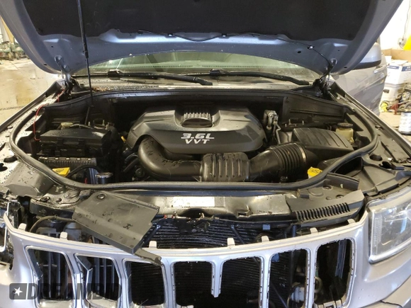 2014 Jeep Grand Cherokee Laredo with VIN 1C4RJFAG8EC150477, listed as a Copart auction lot 89332515 with 189,914 mi miles and Salvage Title. Bid and sale history available at DreamBid. Image 12.