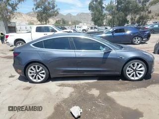 2020 Tesla Model 3 Standard Range Plus with VIN 5YJ3E1EAXLF615781, listed as a IAAI auction lot 42068935 with 96,026 mi miles. Bid and sale history available at carsss.com. Image 13.
