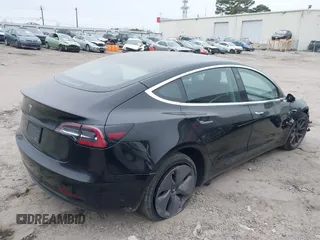 2019 Tesla Model 3 Mid Range with VIN 5YJ3E1EA5KF297213, listed as a IAAI auction lot 41361412 with 93,801 mi miles and . Bid and sale history available at carsss.com. Image 4.
